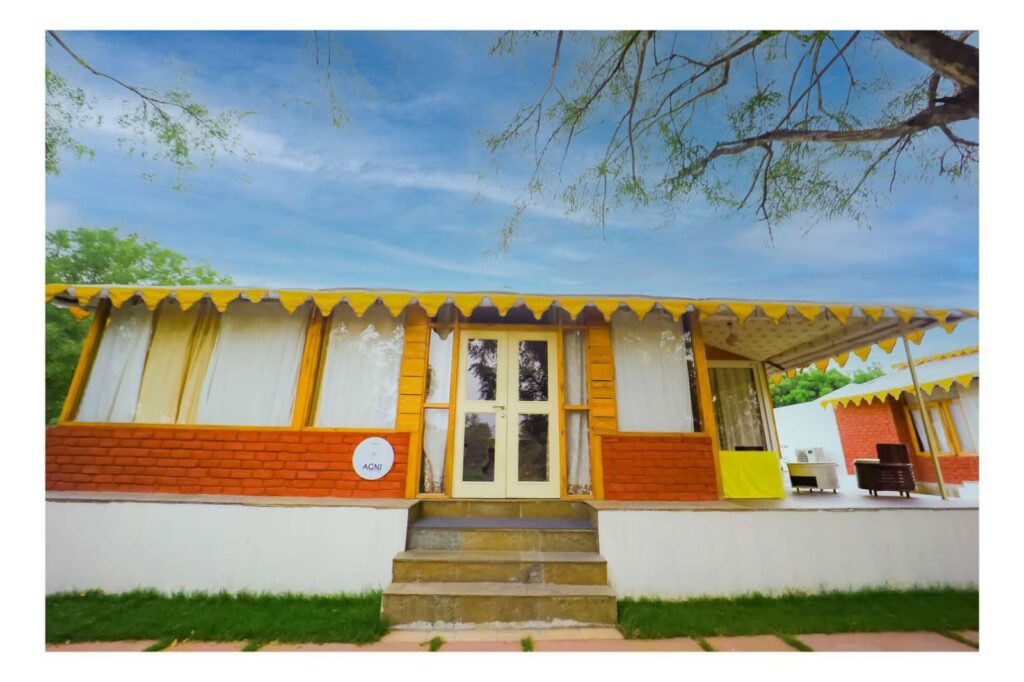 Agni villa exterior with private porch amid lush greenery and nature
